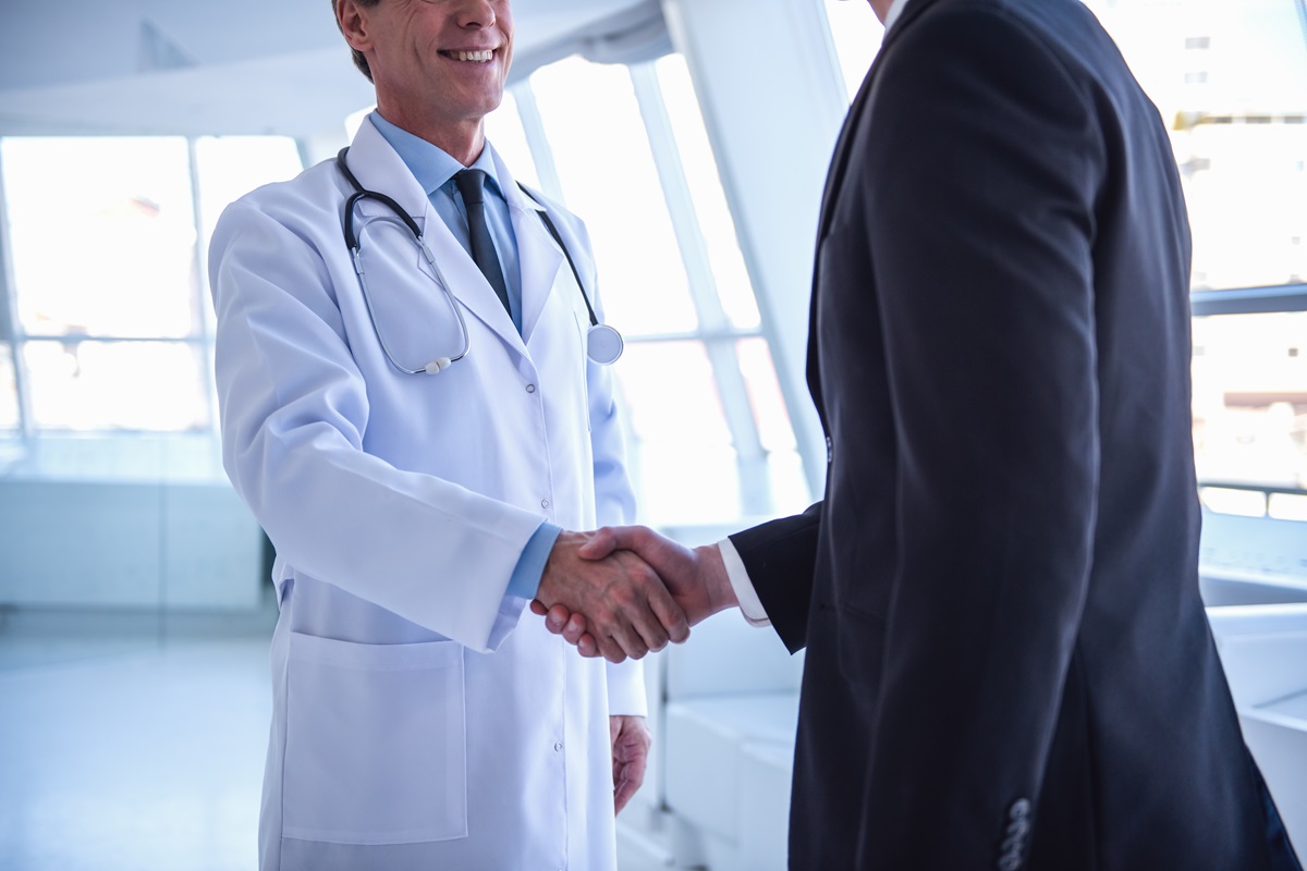 doctor shaking hands with a medical tax accountants